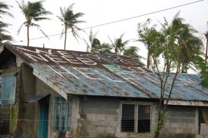 A cry for help etched on a roof outside Guiuan where the typhoon hit land