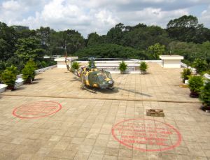 "Escape" Helicopter on the roof of the Presidential Palace in Saigon with red markings where a defector bombed the building in 1973