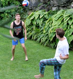 Matt and Alex practice their "keep-uppy" in the garden at Como